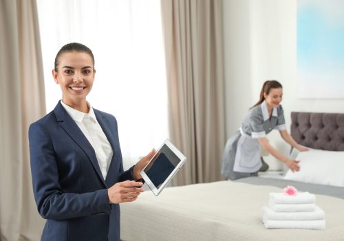 Housekeeping,Manager,With,Tablet,Checking,Maid,Work,In,Hotel,Room.