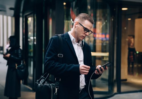 Serious,Businessman,In,Formal,Clothes,With,Eyeglasses,And,Black,Briefcase